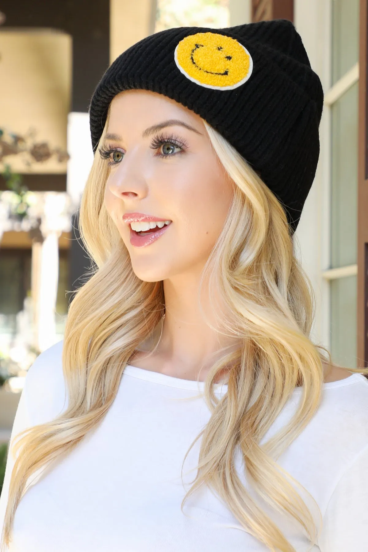 KNITTED BEANIE WITH SMILEY FACE